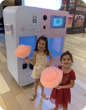 Family enjoying a sweet Funland Vending cotton candy moment at a UAE event
